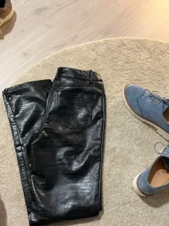 Black faux leather trousers