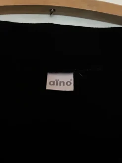 Naisten musta trikoojakku