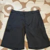 Nike golf shortsit mustat 34