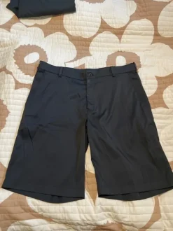 Nike golf shortsit mustat 34