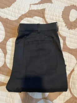 Nike golf shortsit mustat 34